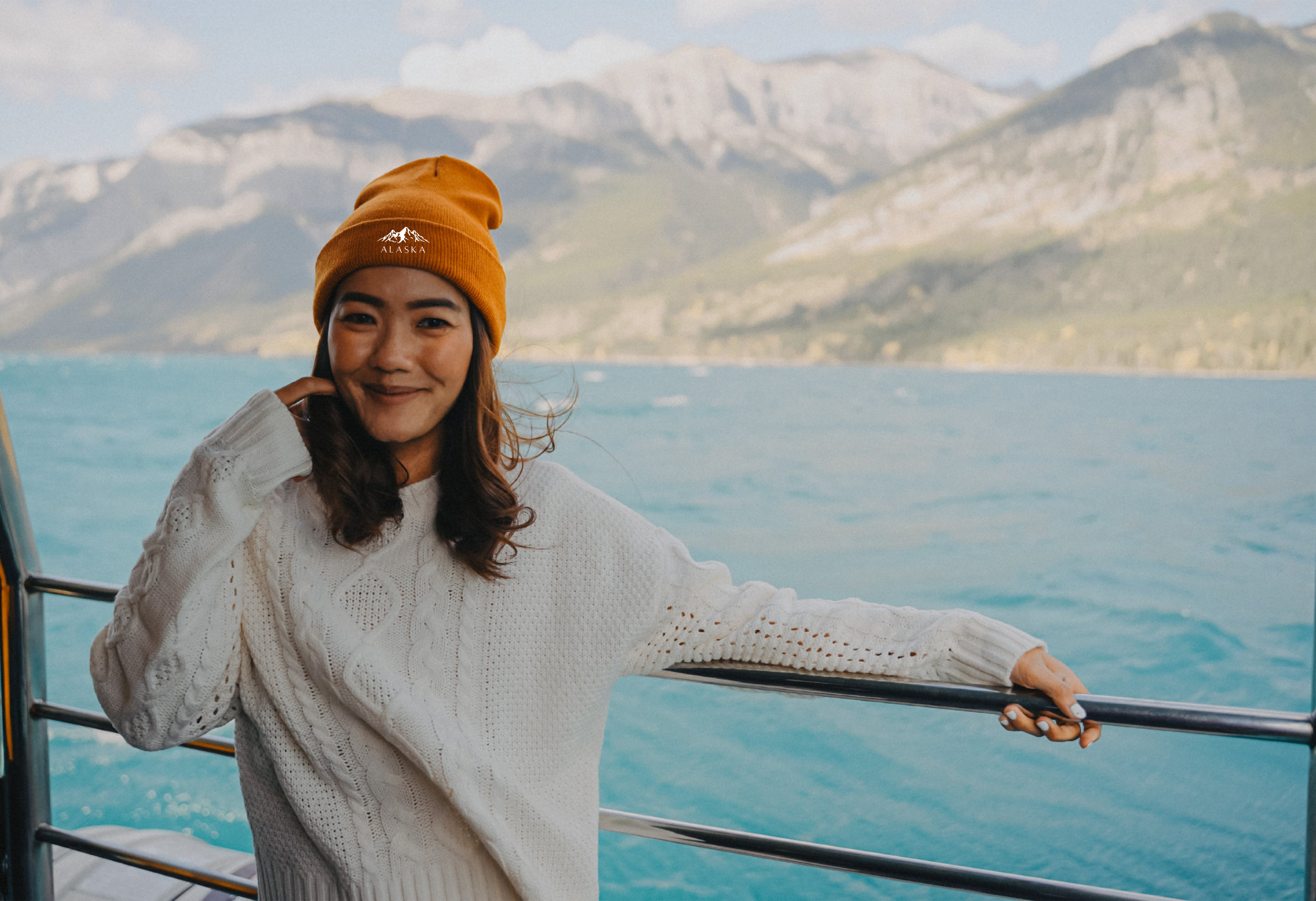 Woman in custom printed beanie in front of mountains