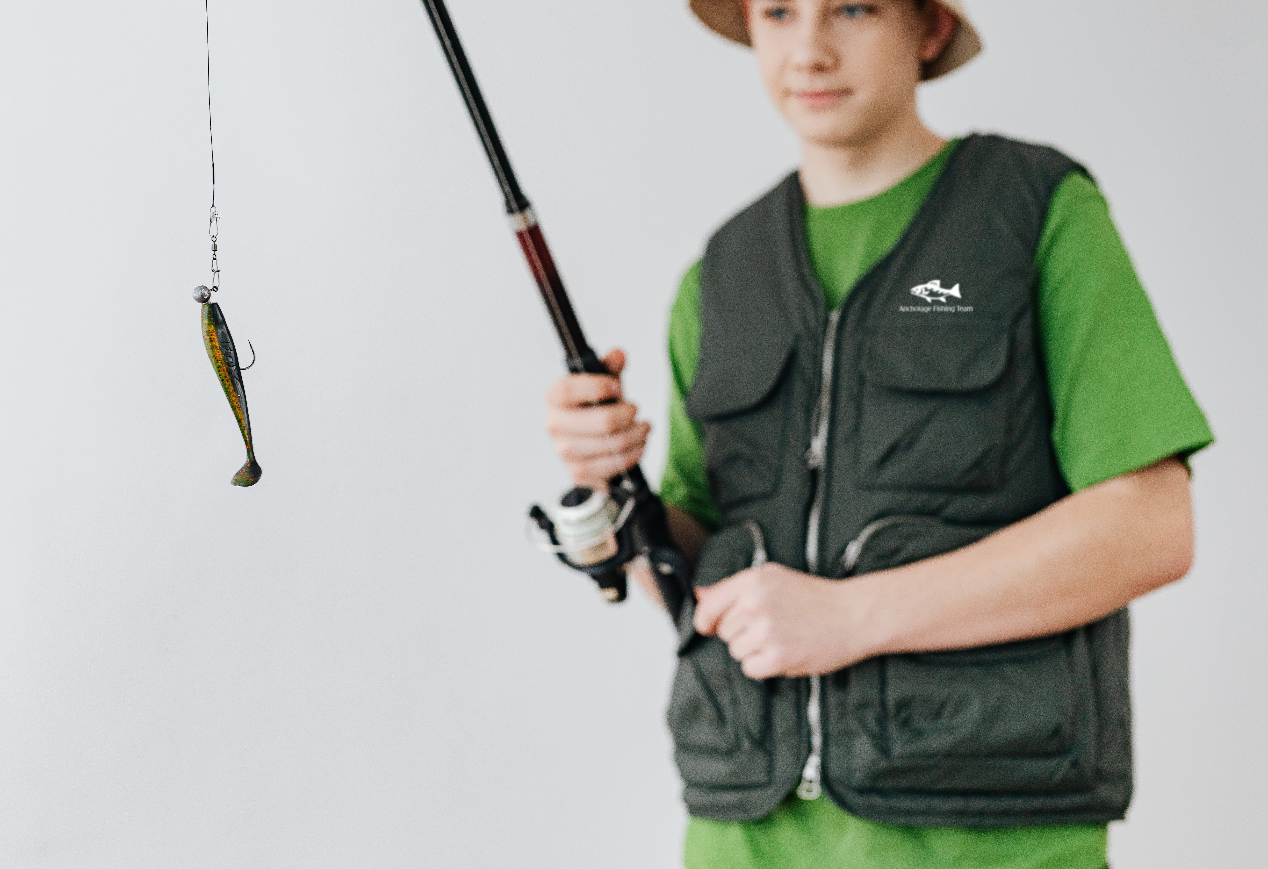 Man with fishing pole wearing custom printed fishing gear