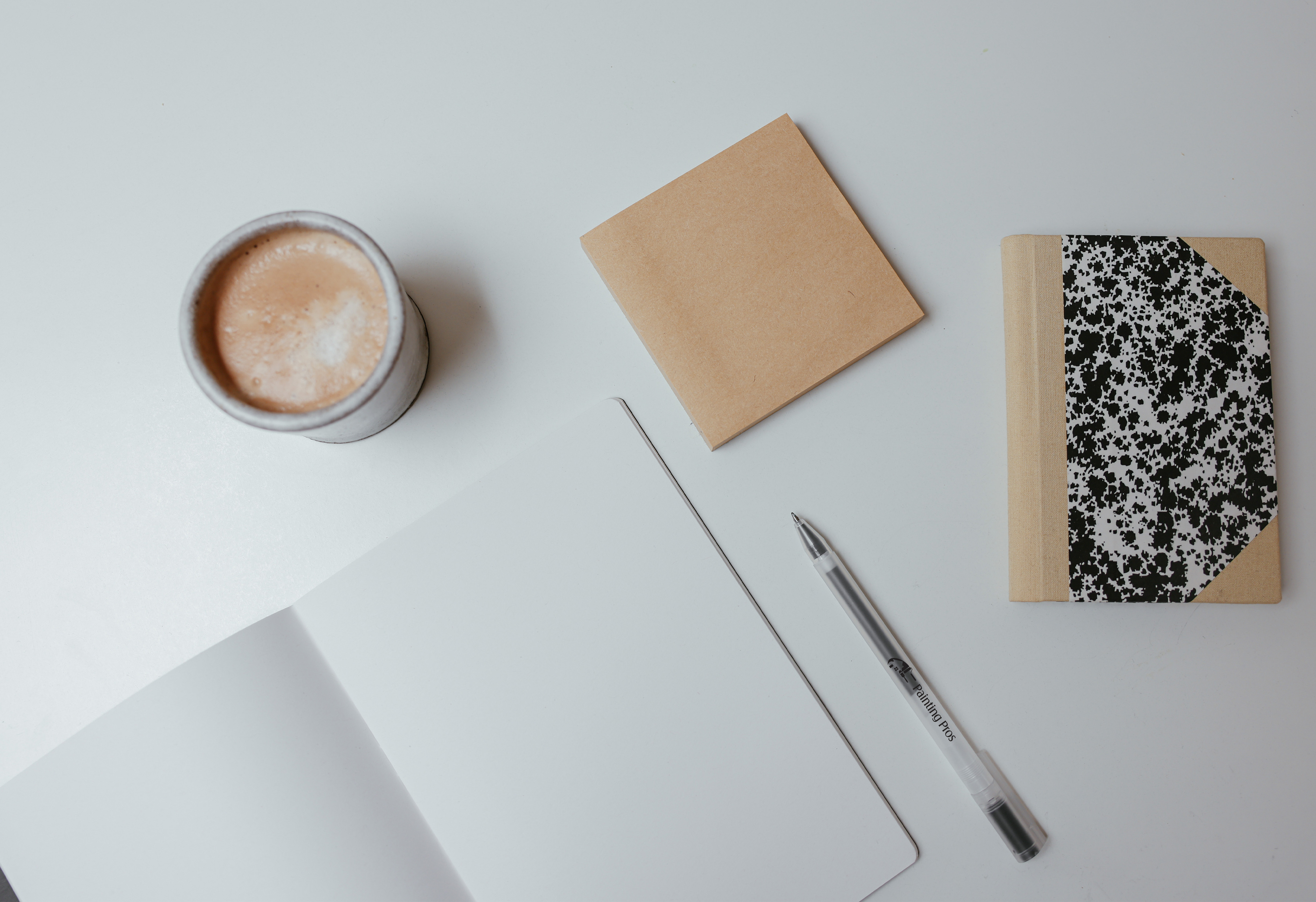 Custom printed pen next to stationary